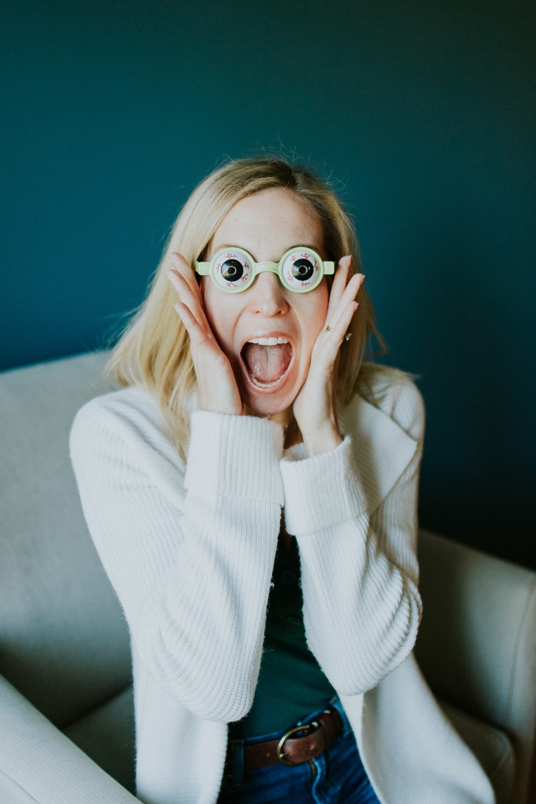 parents with a special needs child Kerri wearing funny eyeball glasses with an excited look on her face